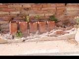 04467 ostia - regio i - insula xiv - terme del bagnino buticosus (i,xiv,8) - raum 4 - hypocaustum - (tubuli) - nordwestecke - 09-2023.jpg